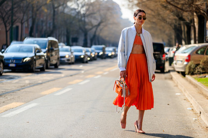 bomber jacket, brittany xavier, crop top, fendi, graphic bag, high heels, leather bag, leather jacket, leather shoes, monogram, orange bag, pink shoes, pleats, printed bag, red skirt, red top, sunglasses, white jacket, MILAN, MFW, fashion week, frenchystyle, FW, jonathan paciullo, street style, AUTUMN WINTER 2019-2020, AW 19-20, FALL WINTER 2019-2020, FW 19-20, atmosphere details, full length, horizontal