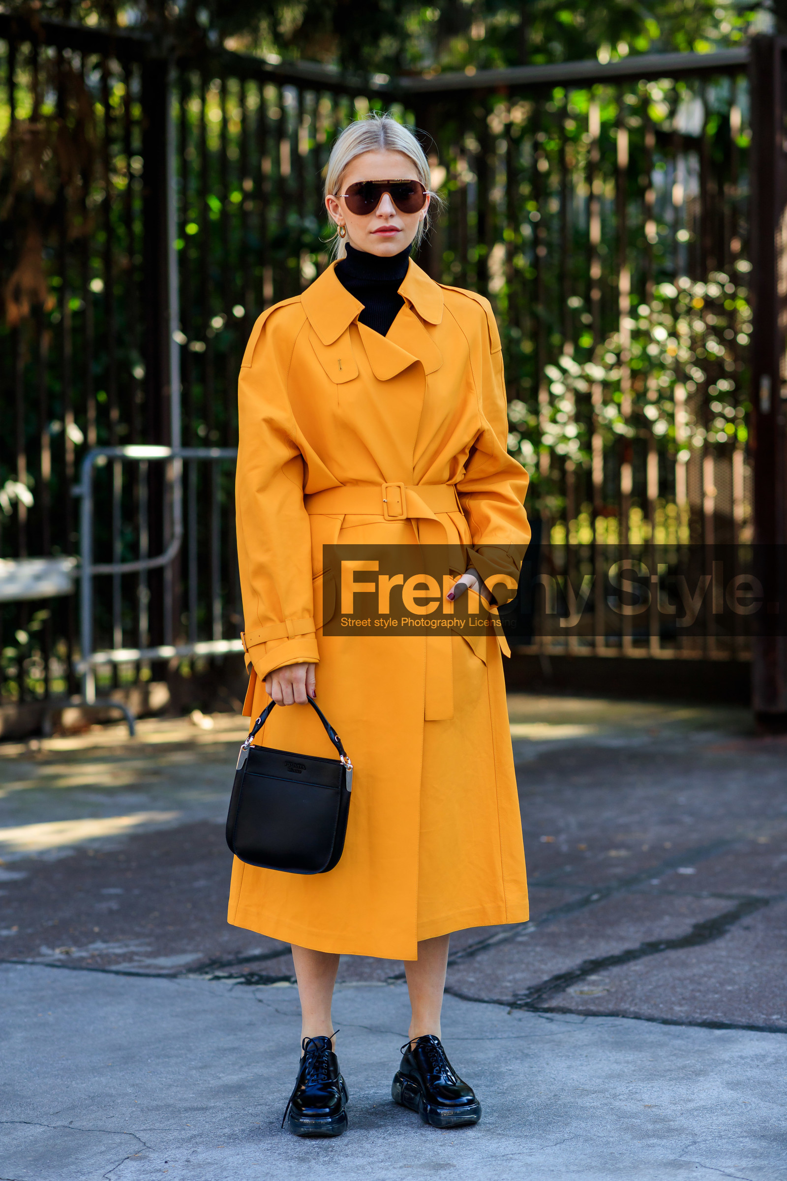 black bag, black shoes, black turtleneck, caro daur, earrings, leather bag, leather shoes, prada, sunglasses, trench coat, yellow coat, MILAN, MFW, fashion week, frenchystyle, FW, jonathan paciullo, street style, AUTUMN WINTER 2019-2020, AW 19-20, FALL WINTER 2019-2020, FW 19-20, vertical, full length