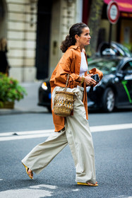 basket, basket bag, beige pants, belt, camel shirt, crop top, flare pants, fluid pants, large pants, Lucy Chadwick, pants, sandals, shirt, white belt, white crop top, yellow sandals, street style, jonathan paciullo, FW, frenchystyle, fashion week, PFW, PARIS, SPRING SUMMER 2022, SS 22, vertical, full length