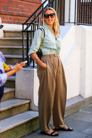 black sunglasses, light green shirt, beige pants, carrot pants, oversize pants, saint laurent bag, chain strap bag, golden chain strap bag, black leather bag, shoulder bag, quilted bag, golden chain bracelet, black leather sandals, flat sandals, fashion week, frenchystyle, FW, jonathan paciullo, street style, vertical, full length