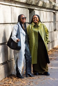 bag, black bag, black pants, boots, coat, dress, duo, green coat, Jessica Willis, kakhi dress, leather bag, leather coat, leather pants, Lindsay Peoples Wagner, long dress, long shirt, oversize bag, pants, shirt, sunglasses, white shirt, street style, jonathan paciullo, FW, frenchystyle, fashion week, PFW, PARIS, SPRING SUMMER 2022, SS 22, vertical, full length