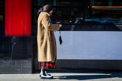 beige jacket, black bag, black skirt, black sweater, camel coat, céline, embroidered skirt, floral, flowers, Fur coat, graphic skirt, headband, hoodie, leather bag, leather shoes, printed skirt, shearling, sunglasses, white boots, street style, jonathan paciullo, FW, frenchystyle, fashion week, NYFW, NEW YORK, AUTUMN WINTER 2018-2019, AW 18-19, FALL WINTER 2018-2019, FW 18-19, atmosphere details, horizontal, full length, Lucy Chadwick