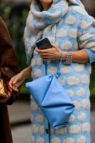 light blue pullover, light blue leather bag, light blue leather clutch, light blue cardigan, white cardigan, white pullover, animal printed cardigan, animal printed pullover, strassed bracelet, diamond bracelet, multi bracelet, iphone, close up detail, bag detail, fashion week, frenchystyle, FW, jonathan paciullo, street style, LFW, LONDON, AUTUMN WINTER 2020-2021, FALL WINTER 2020-2021, FW 20-21, vertical, atmosphere details, detail