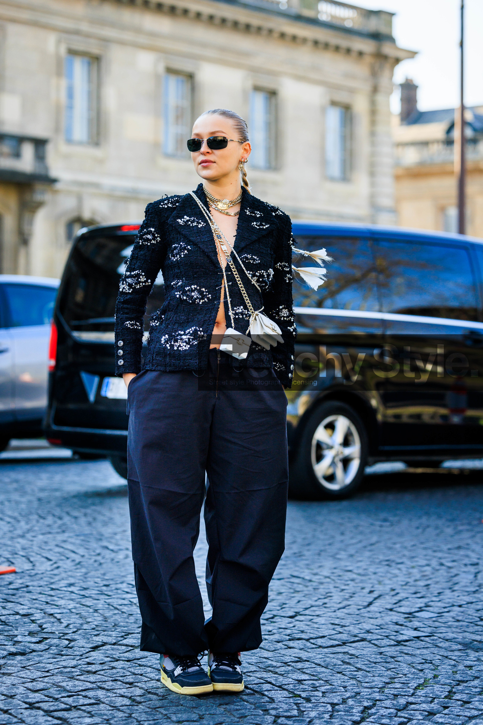 chanel blazer, tweed vest, printed vest, black sunglasses, chanel, mini handbag, chanel mini, white mini bag, baggy pants, black sneakers, multiple chokers, silver chokers, regina anikiy, street style, jonathan paciullo, FW, frenchystyle, fashion week, AUTUMN WINTER 2022-2023, FALL WINTER 2022_2023, FW 22-23, PFW, PARIS, full length, vertical