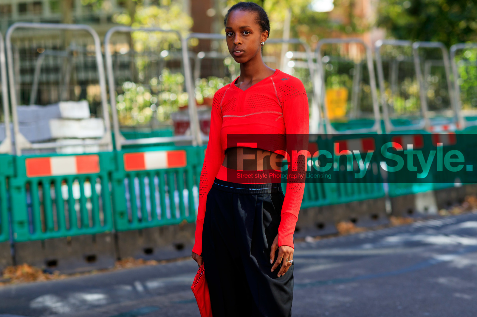 model, cropped top, red top, long sleeves top, asics top, lycra top, prada pants, black bermuda shorts, golden earrings, sportswear, fashion week, frenchystyle, FW, jonathan paciullo, street style, atmosphere details, horizontal, detail