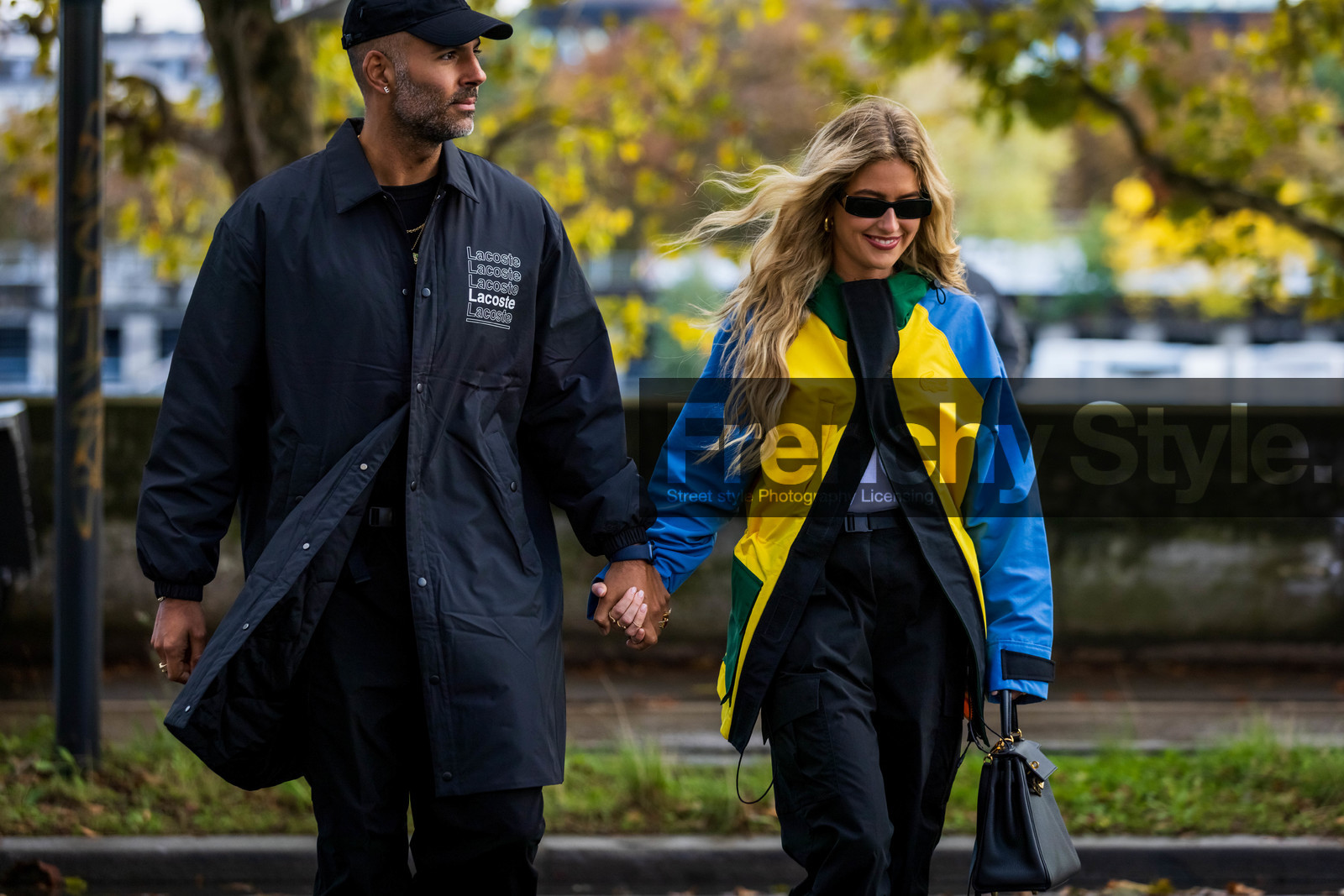 bag, black bag, black cap, black jacket, black pants, black sunglasses, blue jacket, cap, color, Emili Sindlev, jacket, lacoste jacket, lacoste look, leather bag, Mads Emil Grove Moller, pants, sunglasses, yellow jacket, lacoste, fashion week, frenchystyle, FW, jonathan paciullo, street style, PFW, PARIS, SPRING SUMMER 2022, SS 22, horizontal, atmosphere details