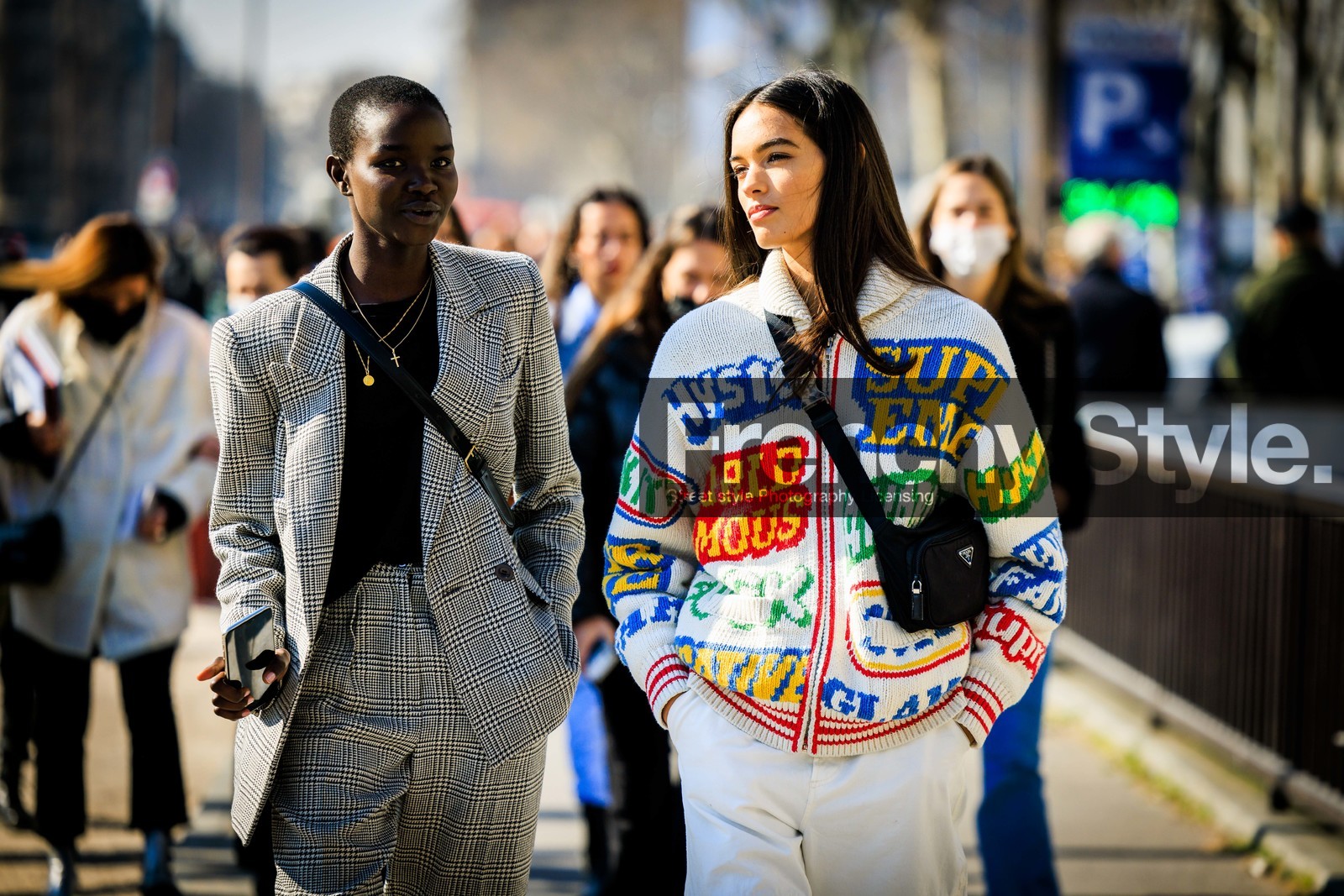 model: black top, plaid suit, grey suit, buttones blazer, crossbody bag, multiple necklace, cross necklace, multicolo cardigan, knitwear, white pants, prada bag, nylon prada bag, black crossbody, model, horizontal, FW 22-23, FALL WINTER 2022_2023, AUTUMN WINTER 2022-2023, fashion week, frenchystyle, FW, jonathan paciullo, street style, PFW, PARIS, atmosphere details, detail