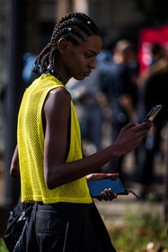 afro braid, black pants, braid, color, hairstyle, menswear, top, yellow top, smartphone, street style, jonathan paciullo, FW, frenchystyle, fashion week, PFW, PARIS, SPRING SUMMER 2022, SS 22, vertical, atmosphere details