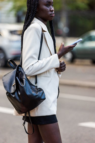 backpack, bag, black backpack, black bag, black skirt, blazer, leather backpack, leather bag, mini skirt, skirt, white blazer, fashion week, frenchystyle, FW, jonathan paciullo, street style, PFW, PARIS, SPRING SUMMER 2022, SS 22, vertical, atmosphere details, model