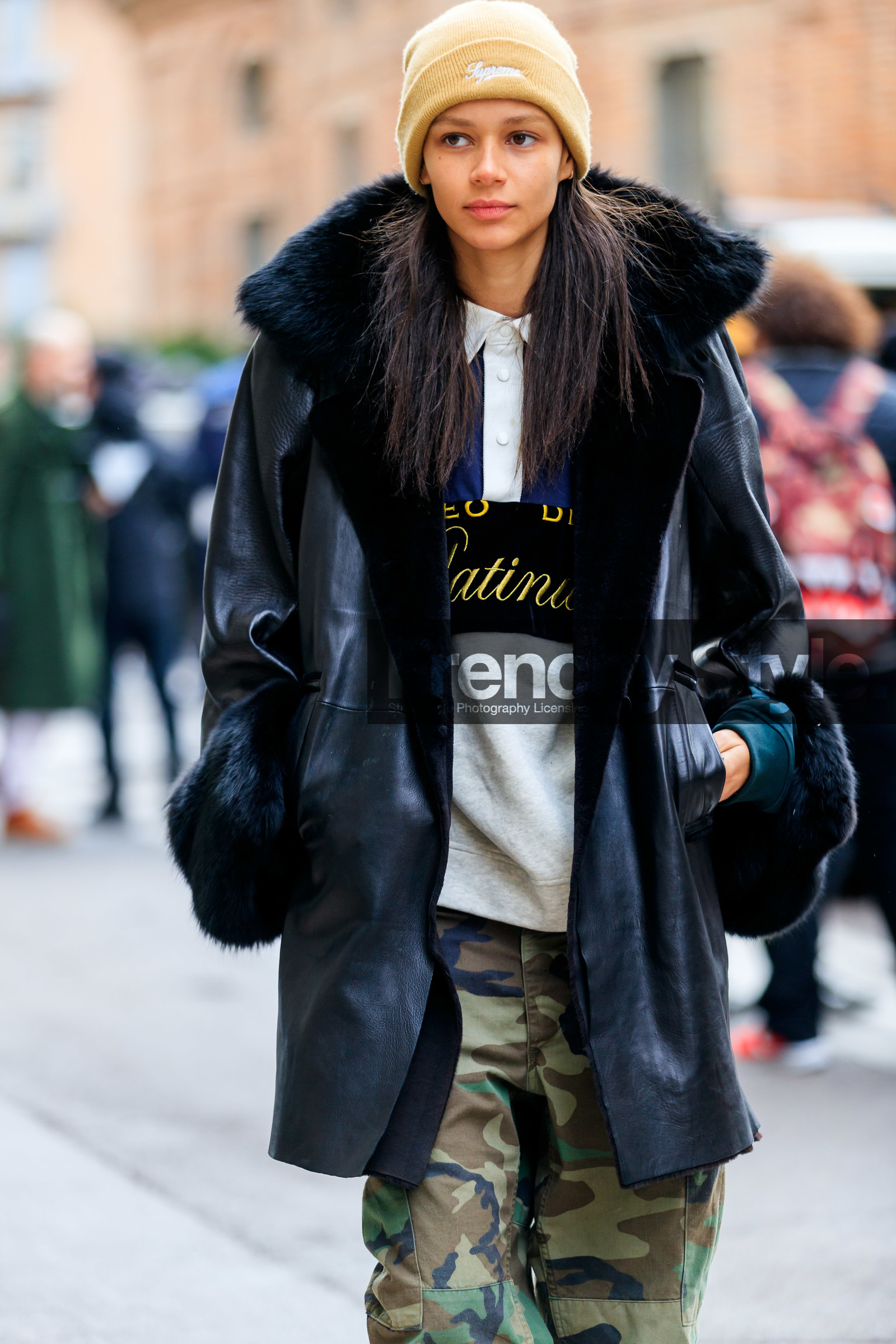 beige hat, black fur, black jacket, camo pants, camouflage, graphic pants, green pants, leather jacket, military pants, model, printed pants, supreme, trousers, MILAN, MFW, fashion week, frenchystyle, FW, jonathan paciullo, street style, AUTUMN WINTER 2019-2020, AW 19-20, FALL WINTER 2019-2020, FW 19-20, vertical, atmosphere details, detail