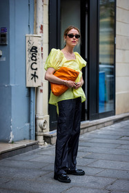 Annabel Rosendahl, bag, ballon sleeves, black loafers, black mocassins, black pants, black sunglasses, bottega veneta bag, color, leather bag, loafers, mocassins, orange bag, pants, pearl earrings, sunglasses, top, yellow top, street style, jonathan paciullo, FW, frenchystyle, fashion week, PFW, PARIS, SPRING SUMMER 2022, SS 22, vertical, full length