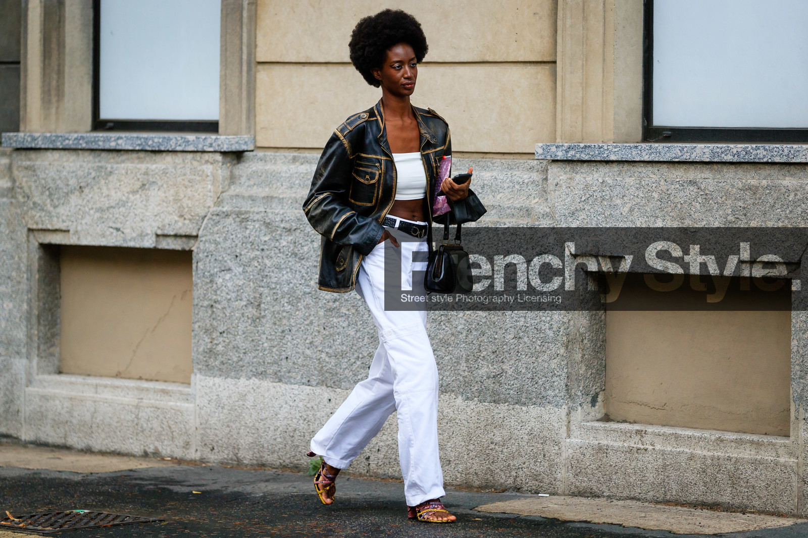 black leather jacket, black leather bag, black leather belt, used jacket, zipped jacket, white pants, flare pants, hand bag, vintage bag, belted pants, white top, cropped top, animal skin belt, sasha payton, street style, jonathan paciullo, FW, frenchystyle, fashion week, MFW, MILAN, SPRING SUMMER 2021, SS 21, horizontal, atmosphere details, full length, model