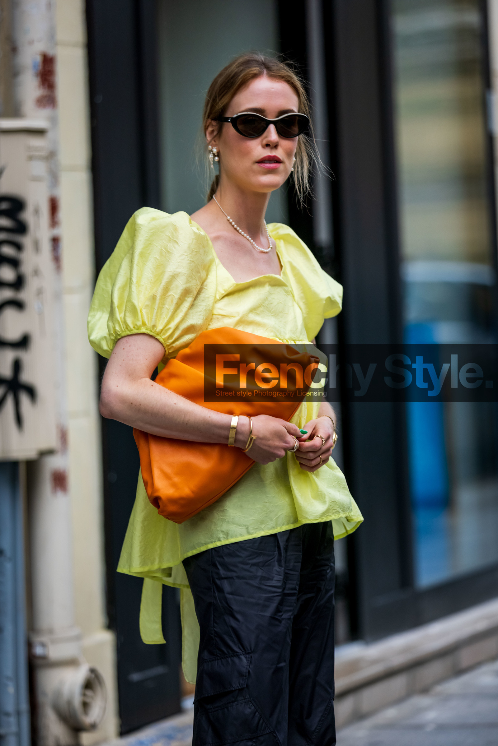 Annabel Rosendahl, bag, ballon sleeves, black pants, black sunglasses, bottega veneta bag, color, leather bag, orange bag, pants, pearl earrings, sunglasses, top, yellow top, street style, jonathan paciullo, FW, frenchystyle, fashion week, PFW, PARIS, SPRING SUMMER 2022, SS 22, vertical, atmosphere details