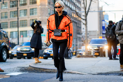 black bag, black belt, black denim, black shoes, black sweater, denim pants, fanny pack, graphic jacket, high heels, hoodie, jeans, leather bag, leather belt, leather shoes, orange jacket, printed jacket, sunglasses, trousers, street style, jonathan paciullo, FW, frenchystyle, fashion week, NYFW, NEW YORK, AUTUMN WINTER 2018-2019, AW 18-19, FALL WINTER 2018-2019, FW 18-19, atmosphere details, horizontal, full length, vanessa hong