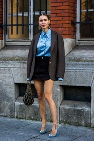 amina muaddi shoes, bag, black bag, black denim, black skirt, blazer, blue heels, blue shirt, brown blazer, chanel earrings, denim shirt, denim skirt, earrings, gold bag, gold chain, gold earrings, mini skirt, oversize blazer, Pernille Teisbaek, shirt, skirt, statement bag, statement shoes, the attico skirt, street style, jonathan paciullo, FW, frenchystyle, fashion week, PFW, PARIS, SPRING SUMMER 2022, SS 22, vertical, full length