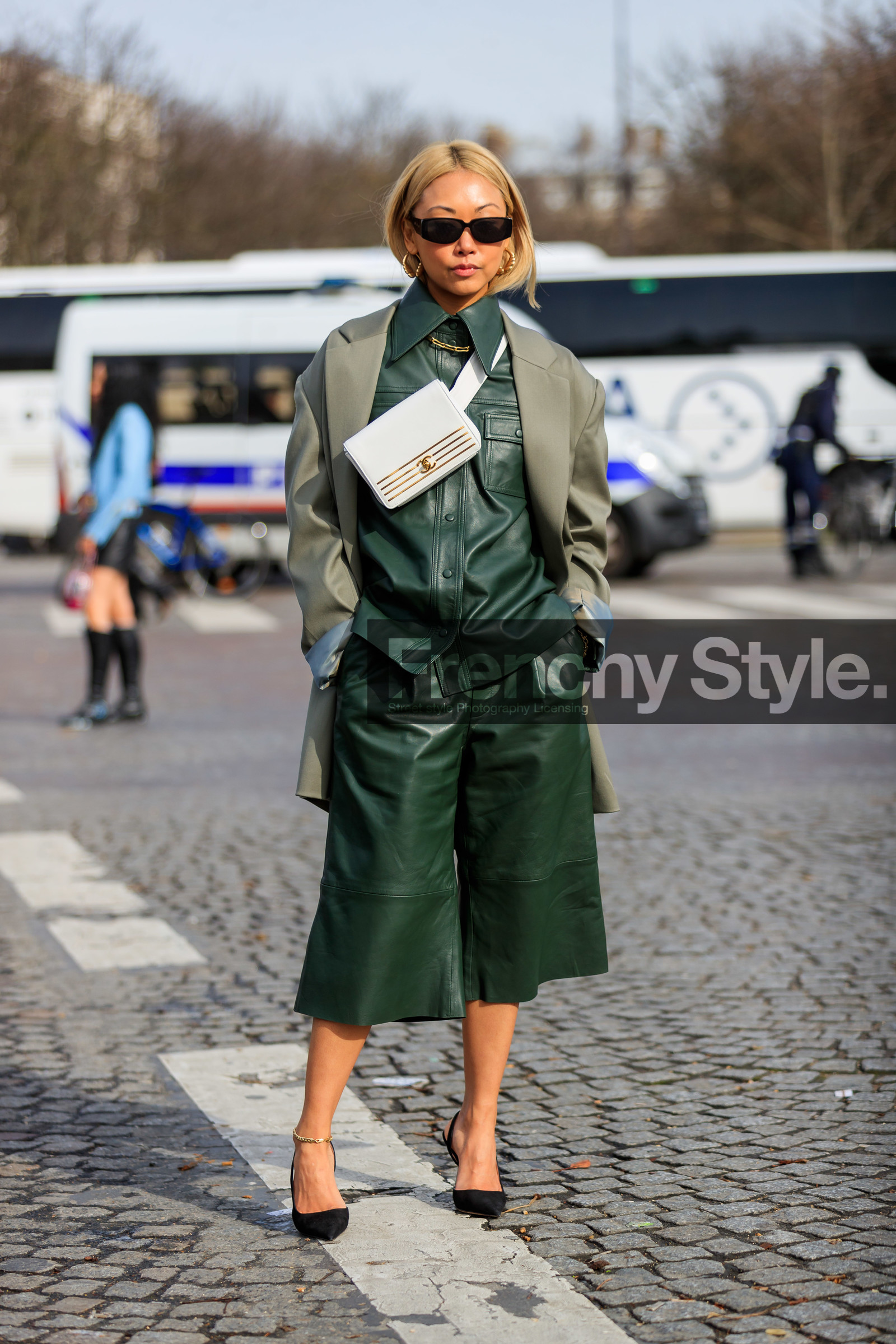 vanessa hong, green leather shirt, green leather pants, kaki jacket, white leather bag, white leather belt, belt bag, crossbody bag, striped bag, small sunglasses, black sunglasses, golden earrings, golden necklace, hoop earrings, big chain necklace, golden bag, green leather bermuda shorts, black suede shoes, sharp end shoes, chanel bag, fashion week, frenchystyle, FW, jonathan paciullo, street style, PFW, PARIS, vertical, full length