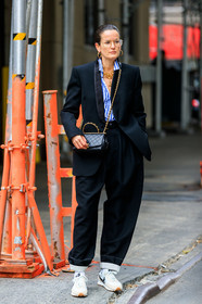 Lucy Chadwick, black jacket, black leather bag, black pants, blue shirt, white shirt, striped shirt, big chain necklace, multi necklace, charms necklace, golden frame glasses, metalic frame sunglasses, aviator glasses, hoop earrings, golden earrings, golden chain strap bag, crossbody bag, chanel bag, quilted bag, satin jacket, loose pants, nike shoes, white sneakers, golden necklace, beige sneakers, suede sneakers, fashion week, frenchystyle, FW, jonathan paciullo, street style, NYFW, NEW YORK, AUTUMN WINTER 2020-2021, FALL WINTER 2020-2021, FW 20-21, vertical, full length